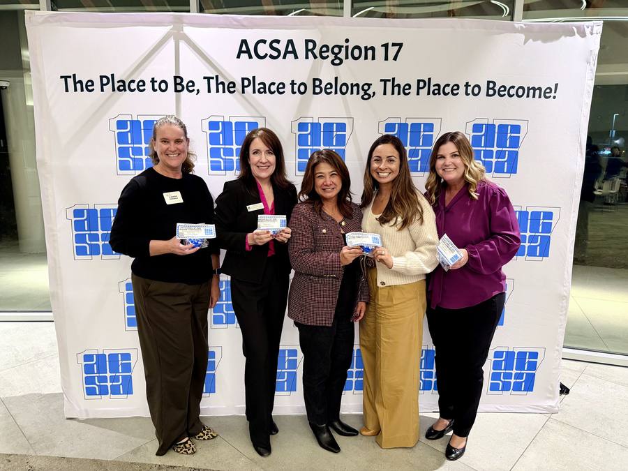 Leisa Winston with four members of her leadership team in front of an ACSA Region 17 backdrop
